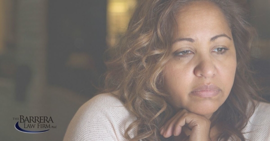 Hispanic woman with a sad expression.